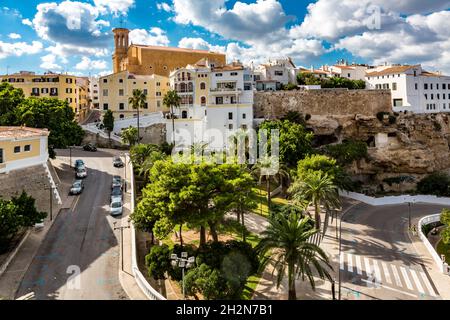 Spain, Balearic Islands, Mahon, View of Parc Rochina in summer with Casa Mir and Esglesia de Santa Maria de Mao in background Stock Photo