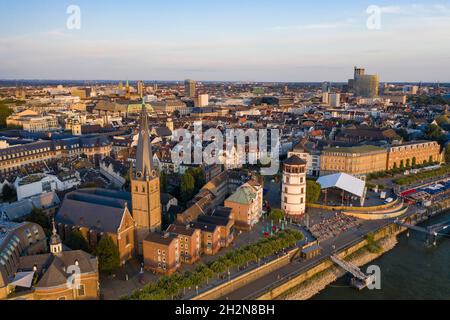 Germany, North Rhine-Westphalia, Dusseldorf, Aerial view of Burgplatz, Schlossturm and Saint Lamberts Church at dusk Stock Photo