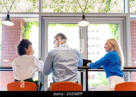 Male and female business professionals working together in office Stock Photo