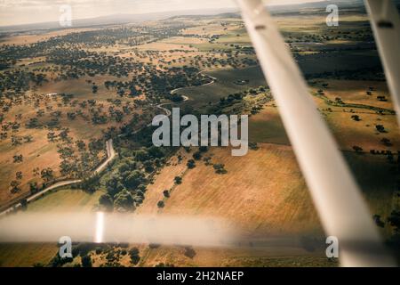 Male pilot operating control panel in airplane Stock Photo