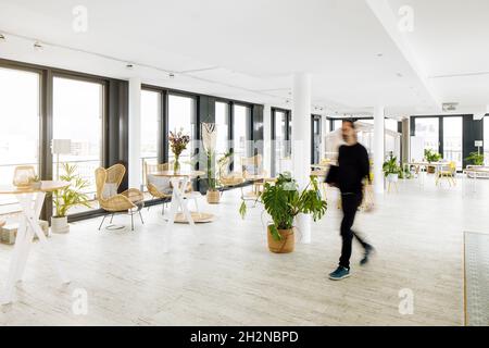 Mature businessman walking in office Stock Photo
