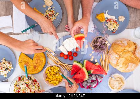 Senior couple having food at dining table Stock Photo