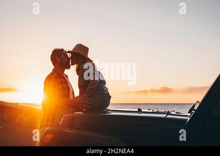 Mature couple kissing at beach Stock Photo
