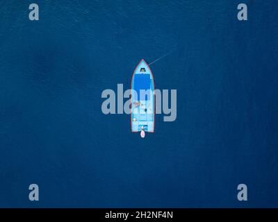 Man motorboat on blue sea Stock Photo