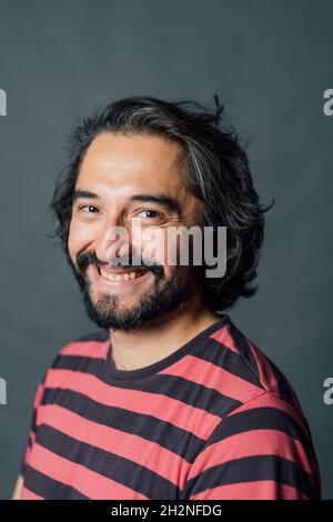 Smiling mid adult man in studio Stock Photo