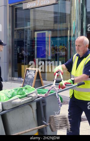 Cardiff, Wales, October 23 2021: Emergency services and council workers in high visibility vests on standby in Cardiff's Queen St pedestrianised area Stock Photo