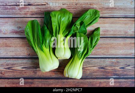 Fresh Asian "pak choi" cabbage on a wooden table. Stock Photo