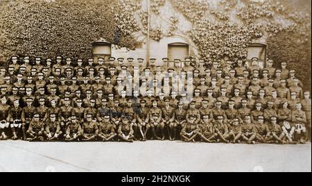 A First World War era group picture of C Company, 8th Officers Cadet Battalion. The officer cadets have white bands around their hats to indicate that they are cadets and each man wears the cap badge of his origional regiment. In the front cantre the traning staff can be seen including both officers and Sargents. Believed to have been at Whittington Barracks, Lichfield. The photographers were from Tamworth, Staffordshire. Stock Photo