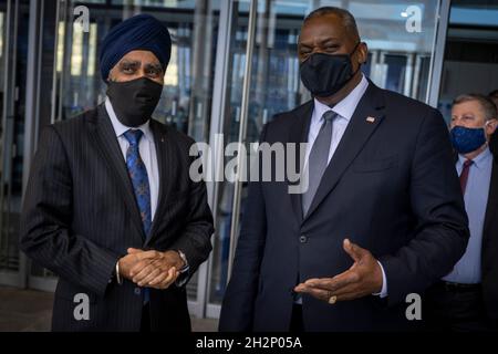 Brussels, Belgium. 22nd Oct, 2021. U.S. Secretary of Defense Lloyd J. Austin III, chats with Canadian Defense Minister Harjit Sajjan at the conclusion of the NATO defense ministerial meeting October 22, 2021 in Brussels, Belgium. Credit: Chad McNeeley/DOD/Alamy Live News Stock Photo