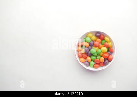 multi-colored sweet candies in a bowl on white background  Stock Photo