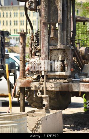 Close up of industrial drilling rig machine to bore a hole in the cement, in the city of Milwaukee, Wisconsin, USA. Stock Photo