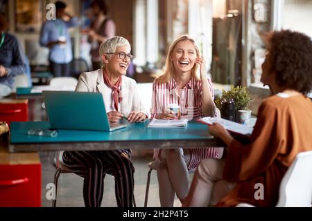 group of people laughing at work. business meeting, negotiations. Stock Photo