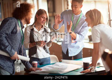Young engineers projecting the drone together in the office Stock Photo