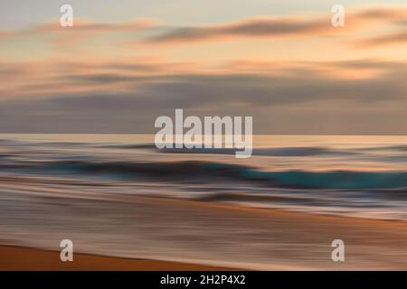 Abstract seascape in light pink, blue, and orange colors. Sand beach, blue ocean and cloudy sky at sunset. Line art, copy space Stock Photo