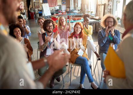 Young employees having professional training in the office; Professional development concept Stock Photo