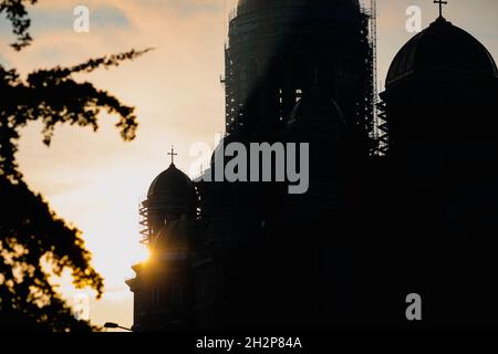 Bucharest, Romania - October 20, 2021: Silhouette of the construction site of “Catedrala Mantuirii Neamului” (People's Salvation Cathedral) at sunrise Stock Photo