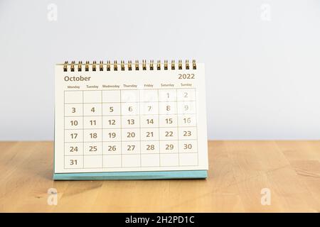 October 2022 calendar on a wooden table Stock Photo