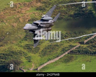 USAF F-15E Strike Eagle from RAF Lakenheathlow level flying sortie in Wales low flying area 7 (LFA7, Mach Loop) Stock Photo