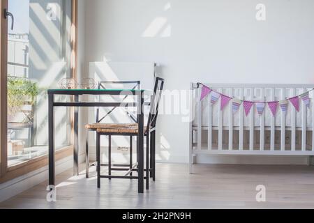 baby bed in white living room or bedroom interior, modern scandinavian design style Stock Photo