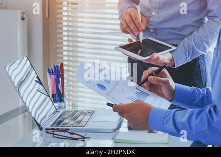 financial charts and graphs analytics, ROI, business people working on monthly report in startup project Stock Photo