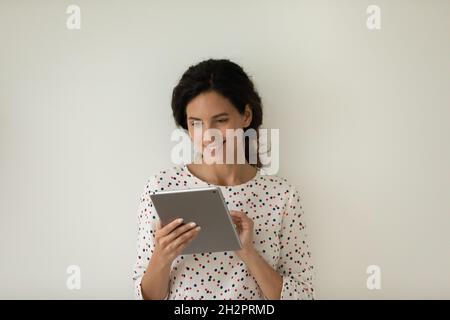 Happy female customer using app on tablet computer Stock Photo
