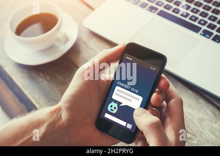 chatbot on website answering questions online, robot assistant help concept Stock Photo