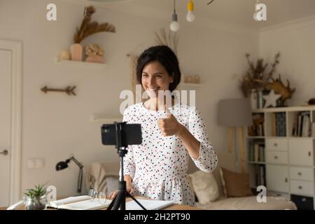 Happy professional blogger recommending company goods, service, recording video Stock Photo