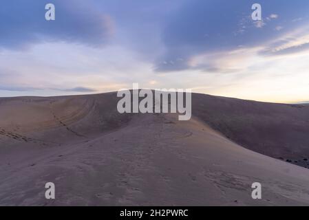 View of St. Anthony's Sand Dunes under the beautiful cloudy sky in Idaho, USA Stock Photo