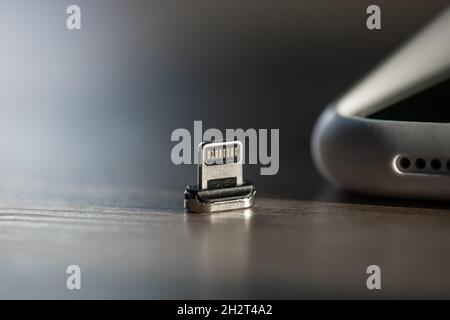 Magnetic cable for charging smartphone, close up. Stock Photo