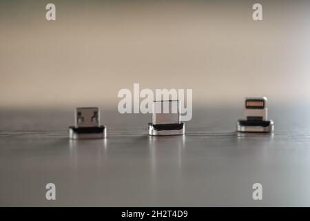 Different types of magnetic attachments for charging your phone. Stock Photo