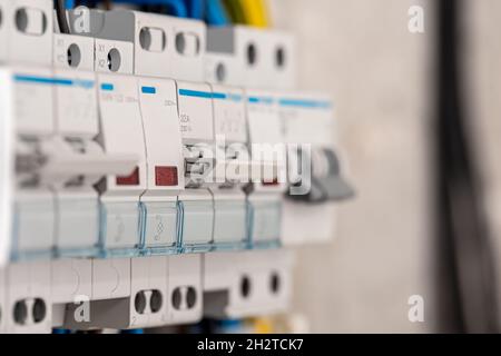 Voltage switchboard with circuit breakers, close up. Stock Photo