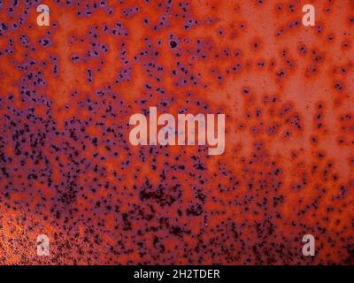 Texture of rusty iron aged old. Grunge metal plate background. Side lit by the rays of the sun Stock Photo