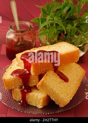 Sponge cake with strawberry jam. Stock Photo