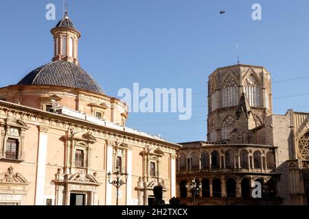 Domed Basilica and octagonal unfinished tower of Cathedral Valencia Spain from Plaza de la Virgen Stock Photo