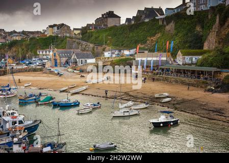 Boats moored in the picturesque working harbour in Newquay in Cornwall. Stock Photo