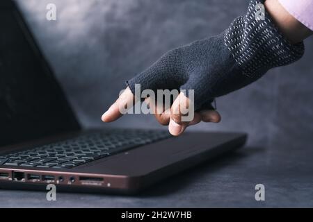 hacker hand stealing data from laptop  Stock Photo