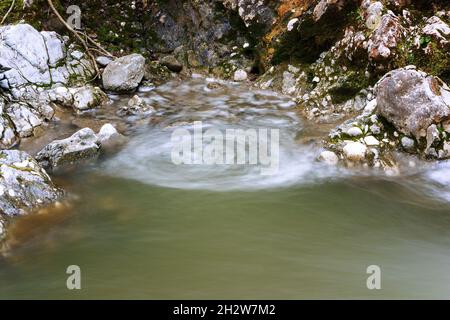 vortex forming on a mountain stream, image taken in Apuseni mountains, Transilvania Stock Photo