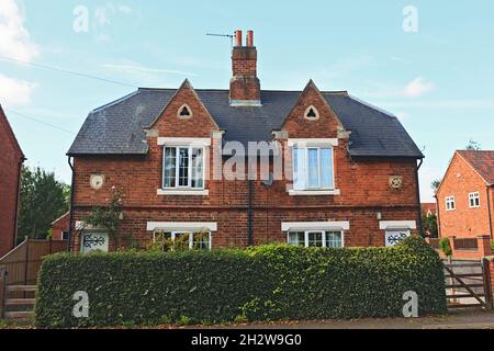 Pair of semi detached period cottages in Cromwell, Nottinghamshire, England, UK Stock Photo