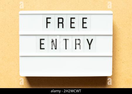 Lightbox with word free entry on wood background Stock Photo