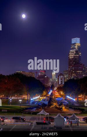 Brightly-lit Benjamin Franklin Parkway after dark, viewed from the plaza in front of the Philadelphia Museum of Art, atop the 'Rocky Steps.' (from the Stock Photo