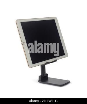Tablet with blank screen on stand holder isolated on white background Stock Photo