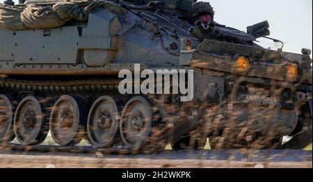 close up of a British army FV103 Spartan CVR-T tracked armoured personnel carrier vehicle in action on a military exercise Wiltshire UK Stock Photo