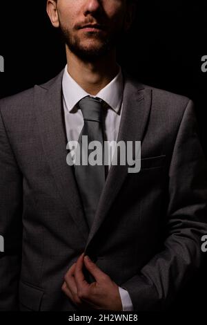 An unknown businessman wearing a smart gray suit Stock Photo