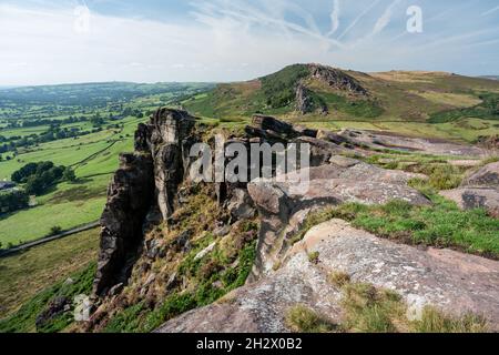 Panoramic view of purple heather at The Roaches, Staffordshire from Hen Cloud in the Peak District National Park, UK. Stock Photo