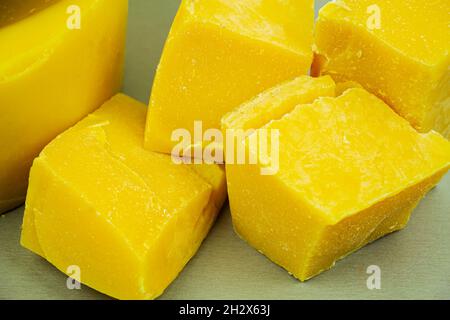 large pieces of natural beeswax, close-up, raw materials for candles Stock Photo