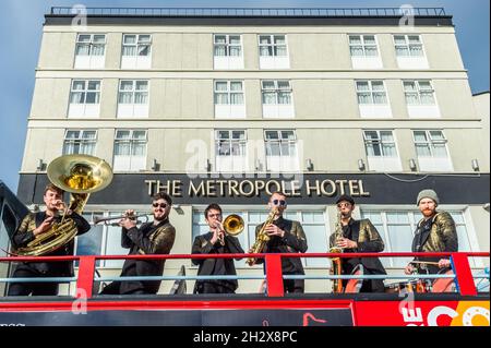 Cork, Ireland. 24th Oct, 2021. The Cork Guinness Jazz Festival continued today. The jazz festival takes place in and around Cork and runs until Monday 25th October. The New Brass Kings from Dublin played on an open top bus which drove around Cork city centre. Credit: AG News/Alamy Live News Stock Photo