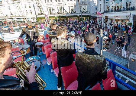 Cork, Ireland. 24th Oct, 2021. The Cork Guinness Jazz Festival continued today. The jazz festival takes place in and around Cork and runs until Monday 25th October. The New Brass Kings from Dublin played on an open top bus which drove around Cork city centre. Credit: AG News/Alamy Live News Stock Photo