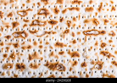 Texture of jewish passover matzah (unleavened bread). Symbol of jewish passover. Jewish bread matzo background, top view Stock Photo