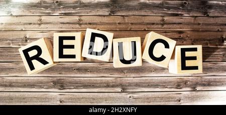 reduce, reuse and rework a word written on a wooden block. Stock Photo