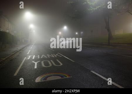 Sheffield, United Kingdom, 8th November, 2020: Thank you NHS rainbow painted on glossop road outside Hallamshire hospital in sheffield. Foggy night. Stock Photo